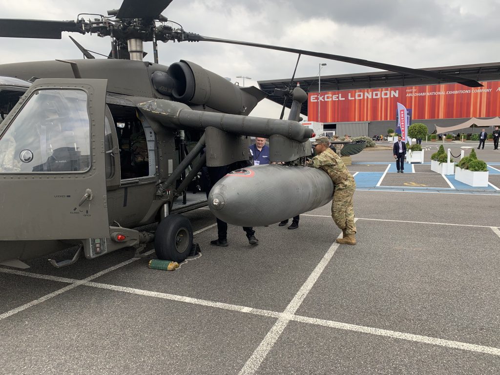 A US soldier leans on a Black Hawk helicopter outside DSEI, 15 September 2021. (Photo: Matt Kennard / Declassified UK)