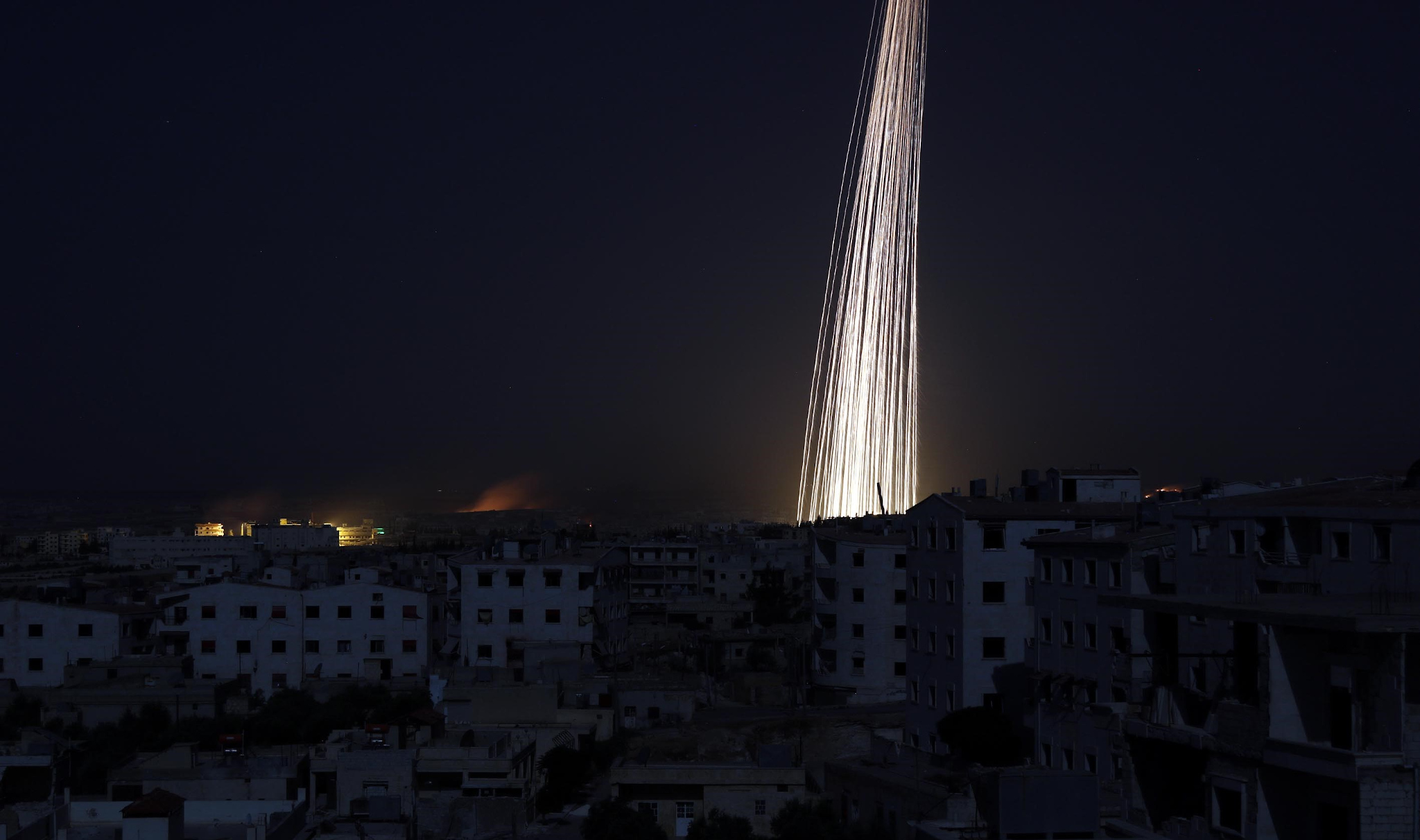 Russian aircraft allegedly attack a Syrian village with white phosphorus in 2016. (Photo: Anas Sabagh via Getty)