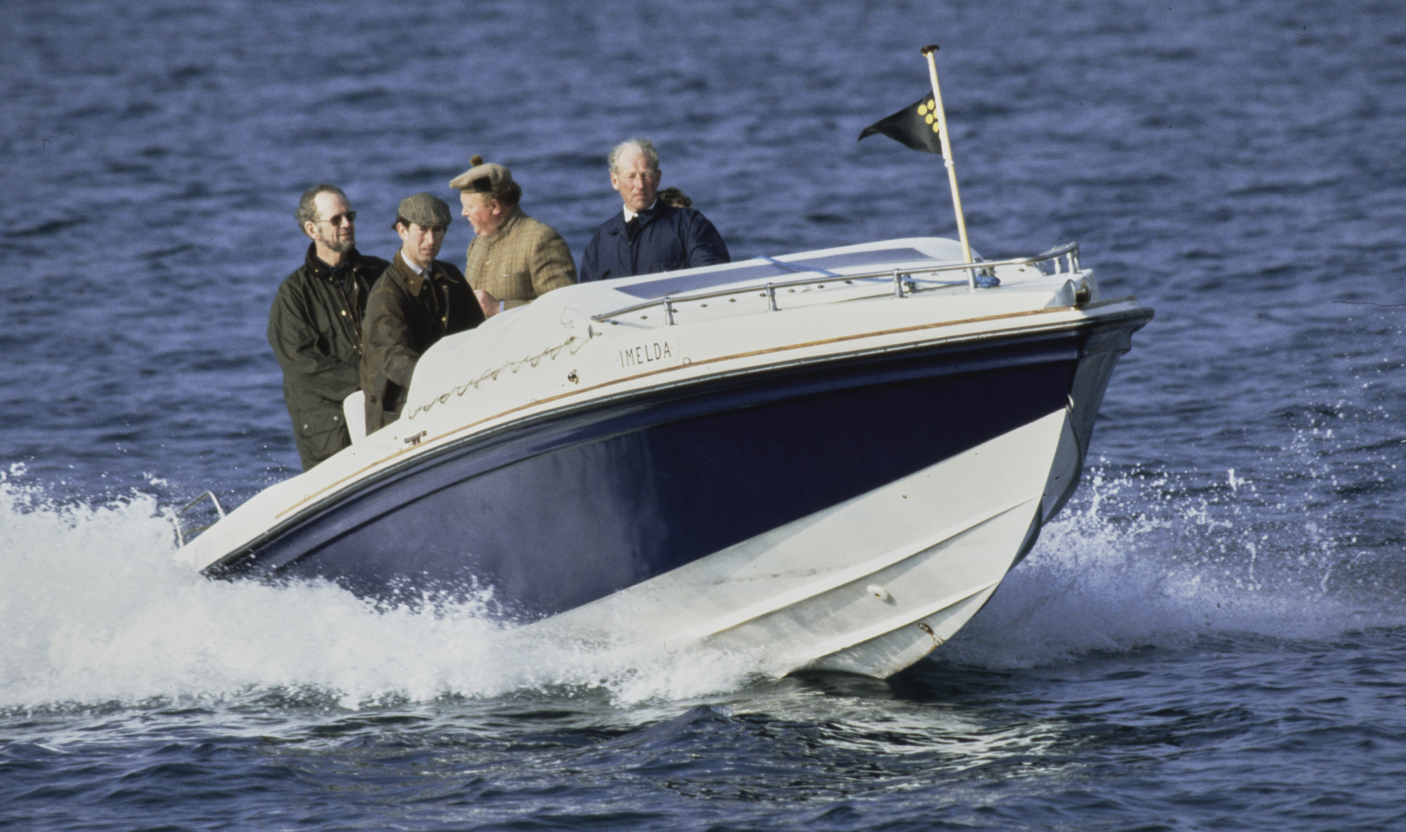 Prince Charles rides a speedboat given to him by Imelda Marcos. (Photo: Tim Graham via Getty)