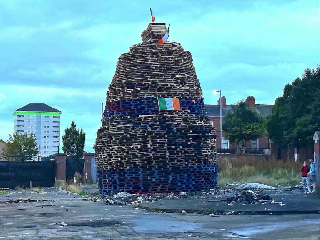 A bonfire with the Irish tricolour flag is prepared to be burnt, north Belfast. (Photo: Matt Kennard/DCUK)