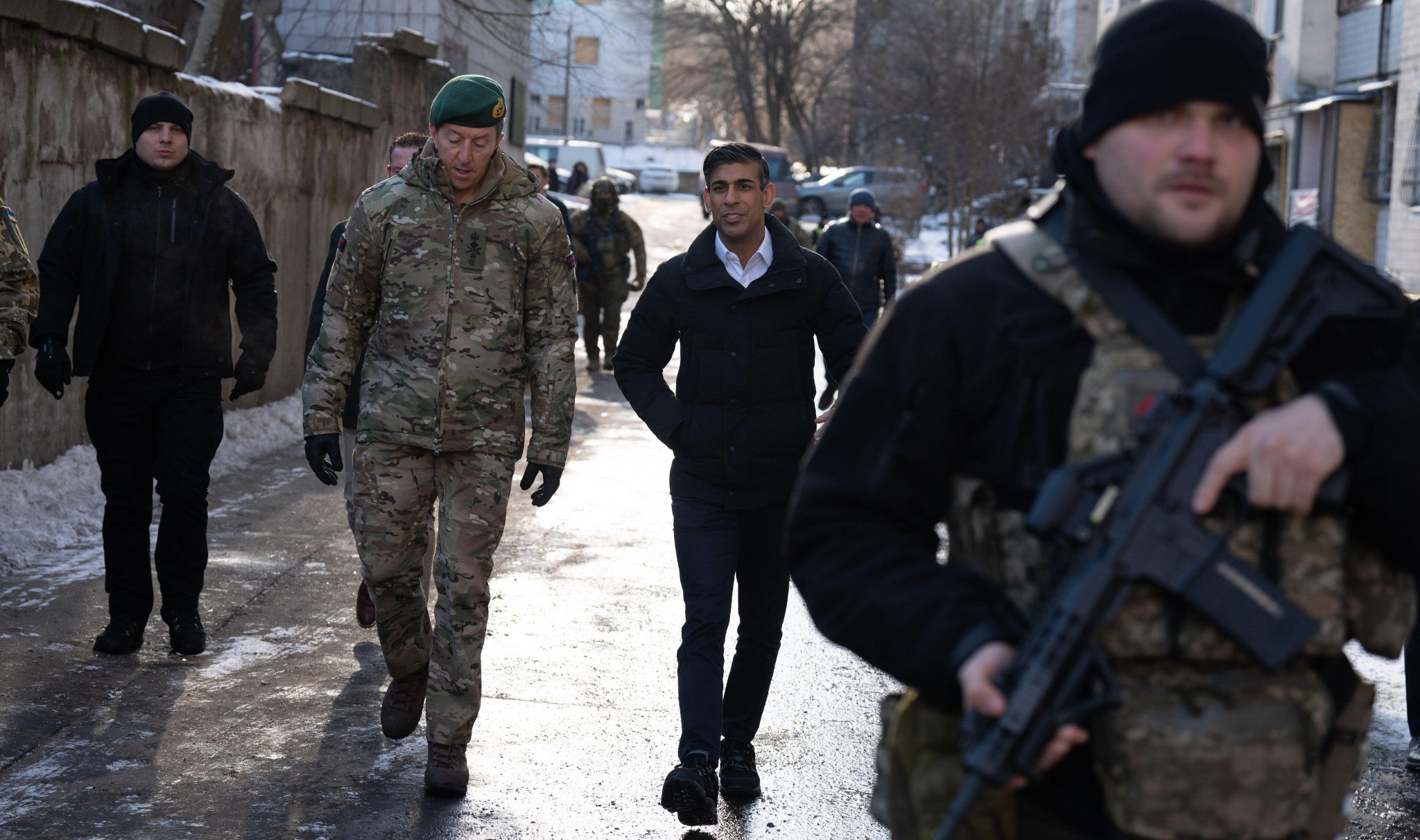 2WBT72M Prime Minister Rishi Sunak and Vice Chief of the Defence Staff, Major General Gwyn Jenkins (left), are shown damaged buildings in Kyiv, Ukraine, ahead of meeting with President Volodymyr Zelensky to announce a major new package of military aid to Ukraine. Picture date: Friday January 12, 2024.