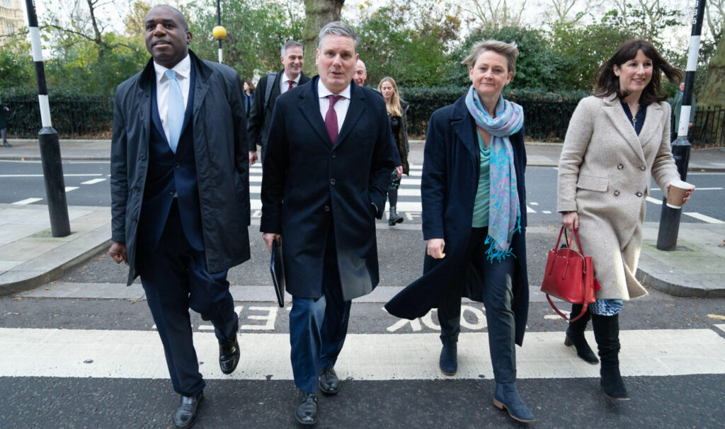 2H8G3MN Labour leader, Keir Starmer (2nd from left) walks to today's shadow cabinet meeting with some of his new appointees including David Lammy (far left) Shadow Foreign secretary, Yvette Cooper (3rd from left) shadow Home Secretary and Rachel Reeves (far right) shadow Chancellor of the Exchequer after yesterday's reshuffle. Picture date: Tuesday November 30, 2021.