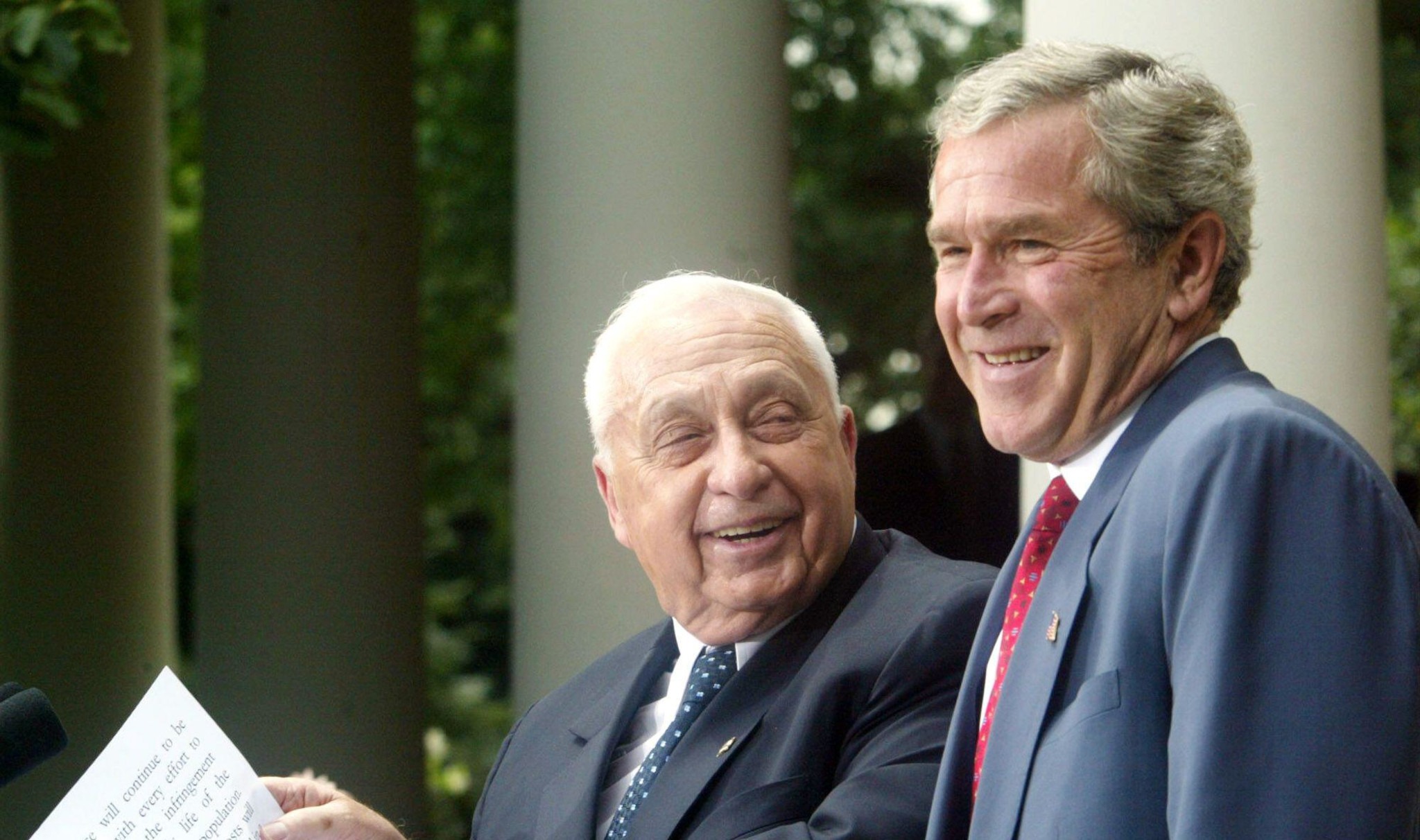 2PF5TF0 Israeli Prime Minister Ariel Sharon,left, and President Bush share a laugh while making remarks during a Rose Garden press conference Tuesday, July 29, 2003, at the White House. Israeli Prime Minister Ariel Sharon is exploring with President Bush the actions Israel wants from the Palestinians to reduce the threat of terror and advance peace prospects. (AP Photo/Rick Bowmer)