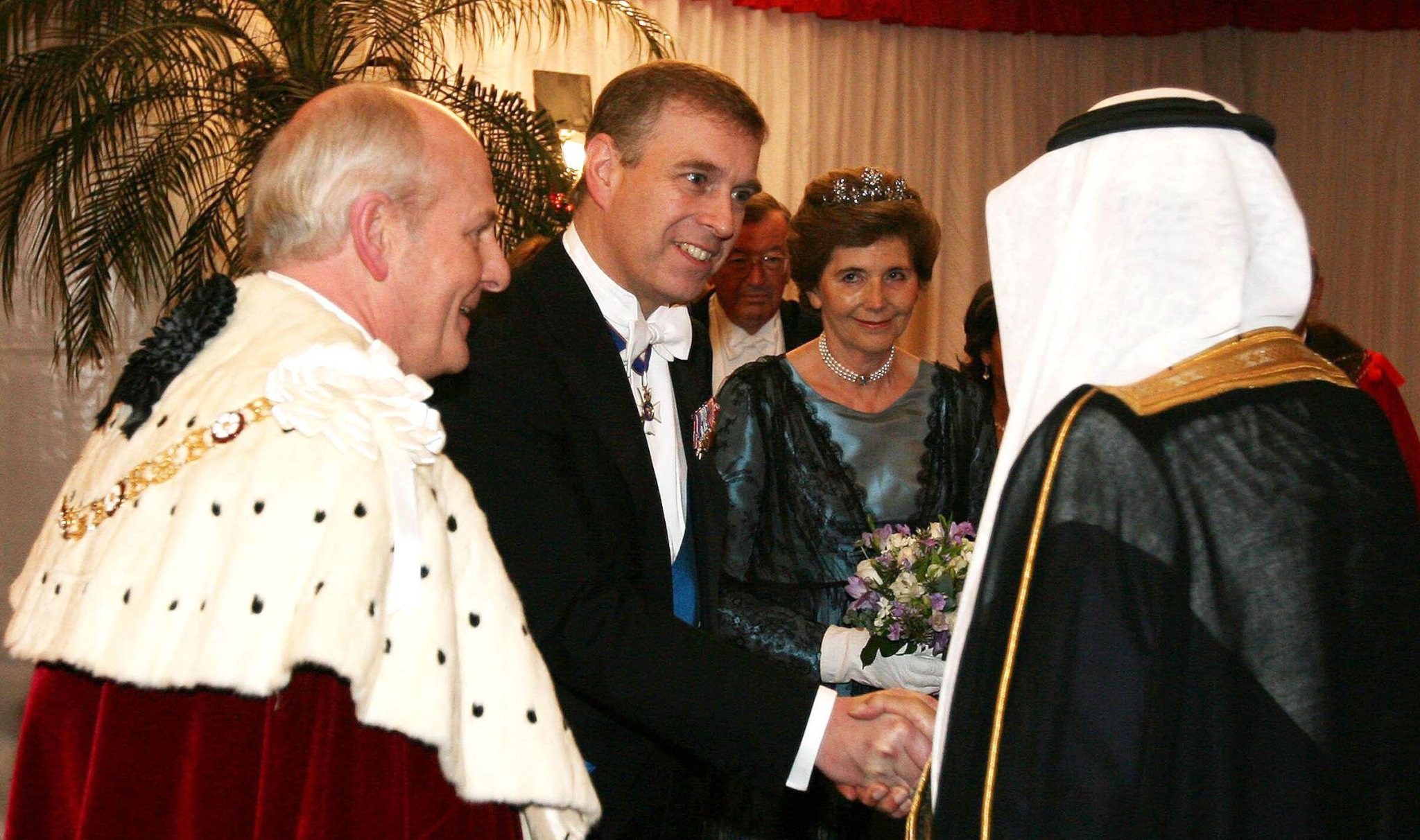 Prince Andrew shakes hands with a Saudi royal