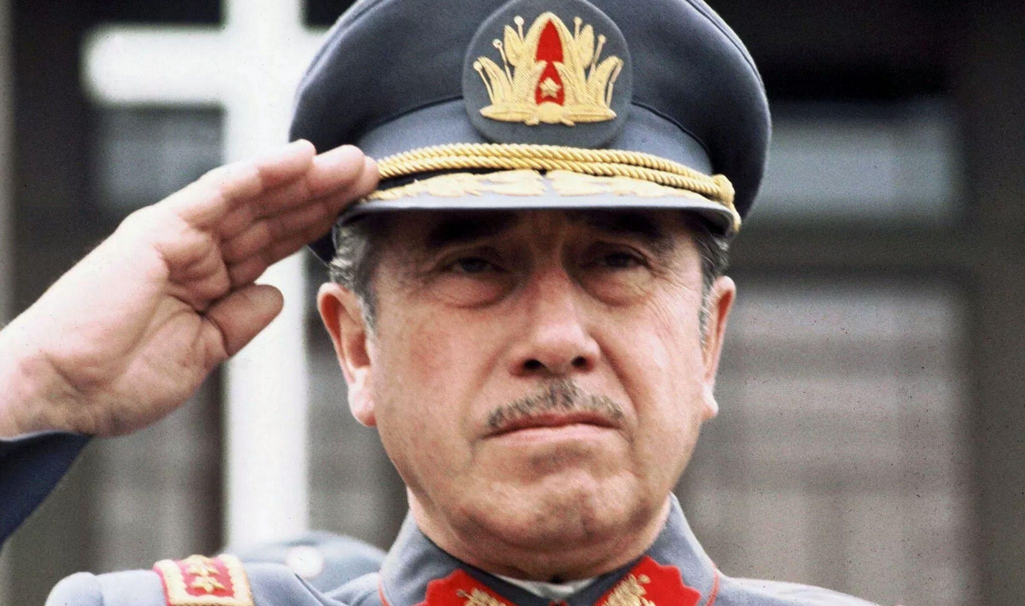 Chilean dictator Augusto Pinochet Ugarte saluting.