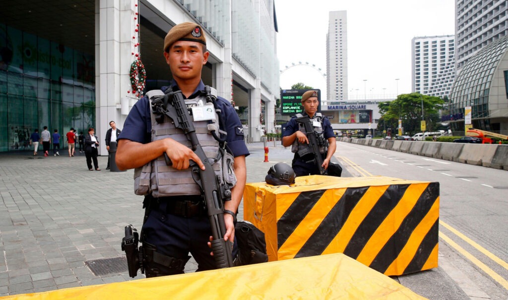 Singaporean security forces, including Gurkhas, man their position around Suntec Convention Center.