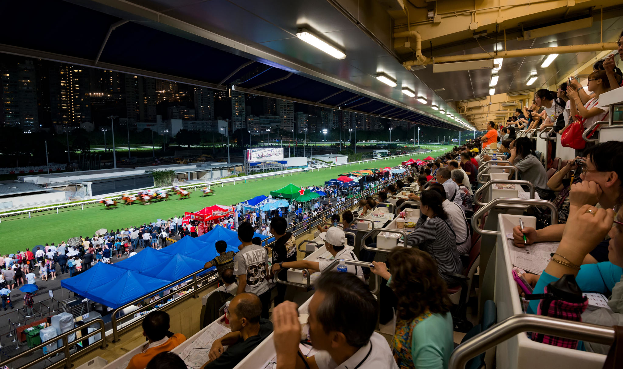Happy Valley horse racing track, Hong Kong, China. The Hong Kong Jockey Club, founded during British rule in 1884, remains popular among residents. (Photo: Bob Henry / Alamy)