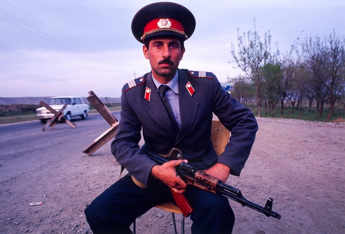 An Azerbaijan policeman at a road block on the route to Nagorno-Karabakh, April 1993. (Photo: Chuck Nacke / Alamy)