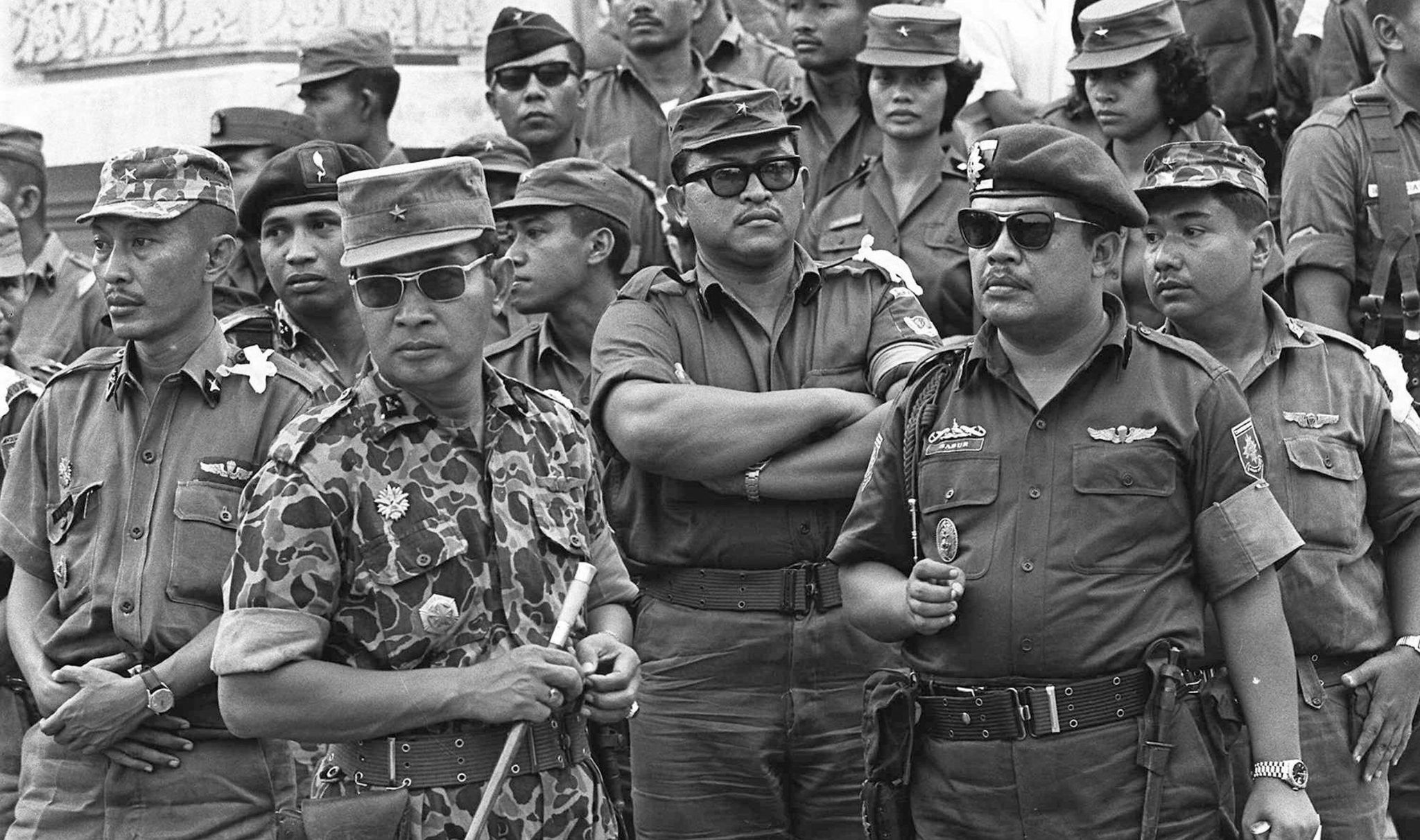 General Suharto, 2nd left with sunglasses, on 6 October 1965 (credit: Associated Press/Alamy)