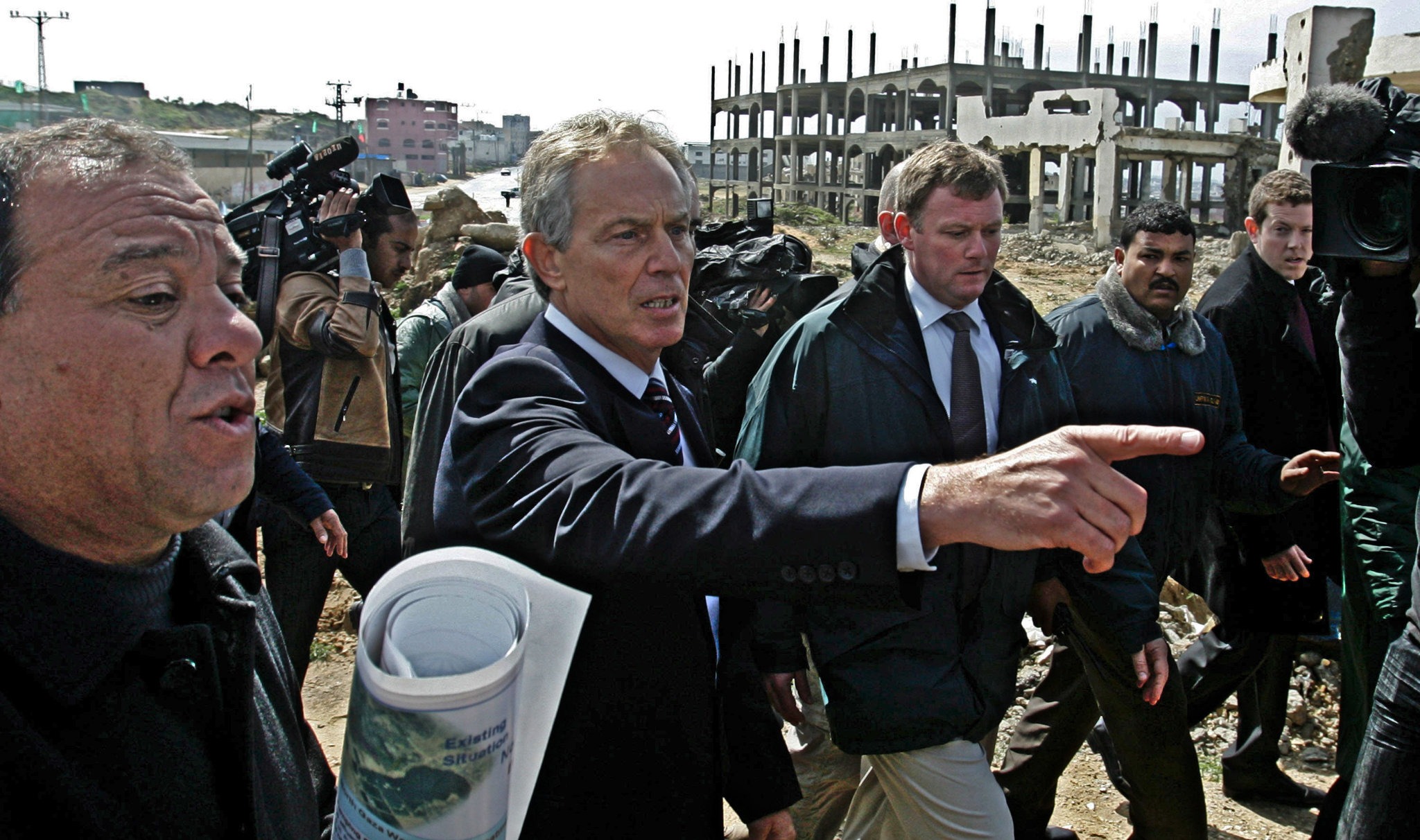 Middle East envoy former British Prime Minister Tony Blair walks the streets during his visit to Beit Lahiya, in the northern Gaza, March 1, 2009. Blair arrived in Gaza on Sunday in his first visit to the Hamas-run enclave since being appointed Middle Ea