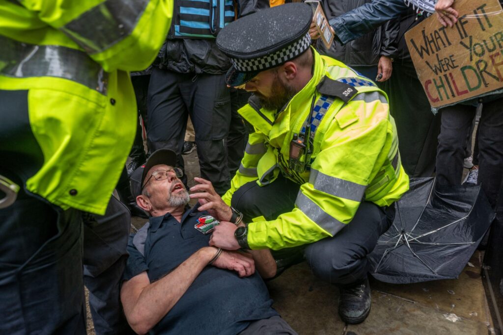 Jon Farley is arrested in July after holding up a Private Eye cartoon (Garry Clarkson / Alamy)