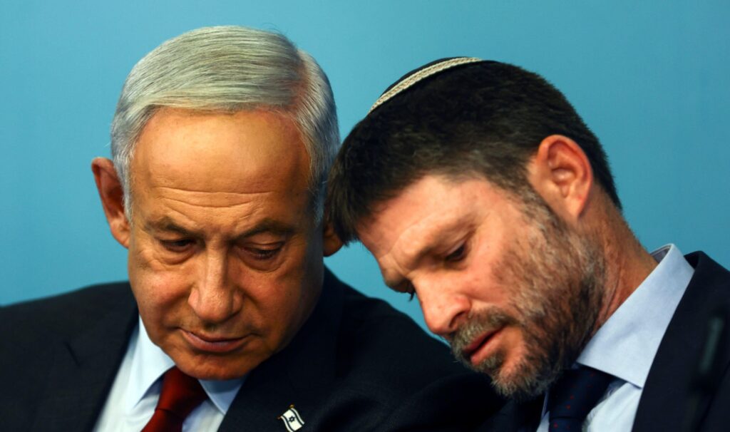 Benjamin Netanyahu and Bezalel Smotrich at a 2023 news conference (Ronen Zvulun / AP / Alamy)